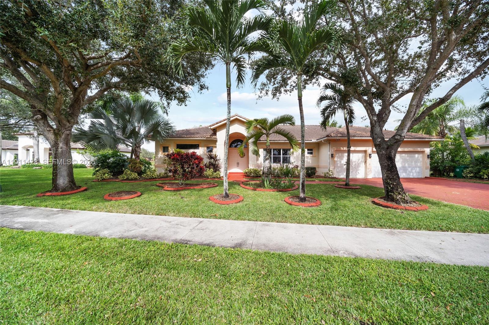 13875 Southwest 41st Street Davie, FL 33330 - Photo 1 of 62 a view of a park with large trees
