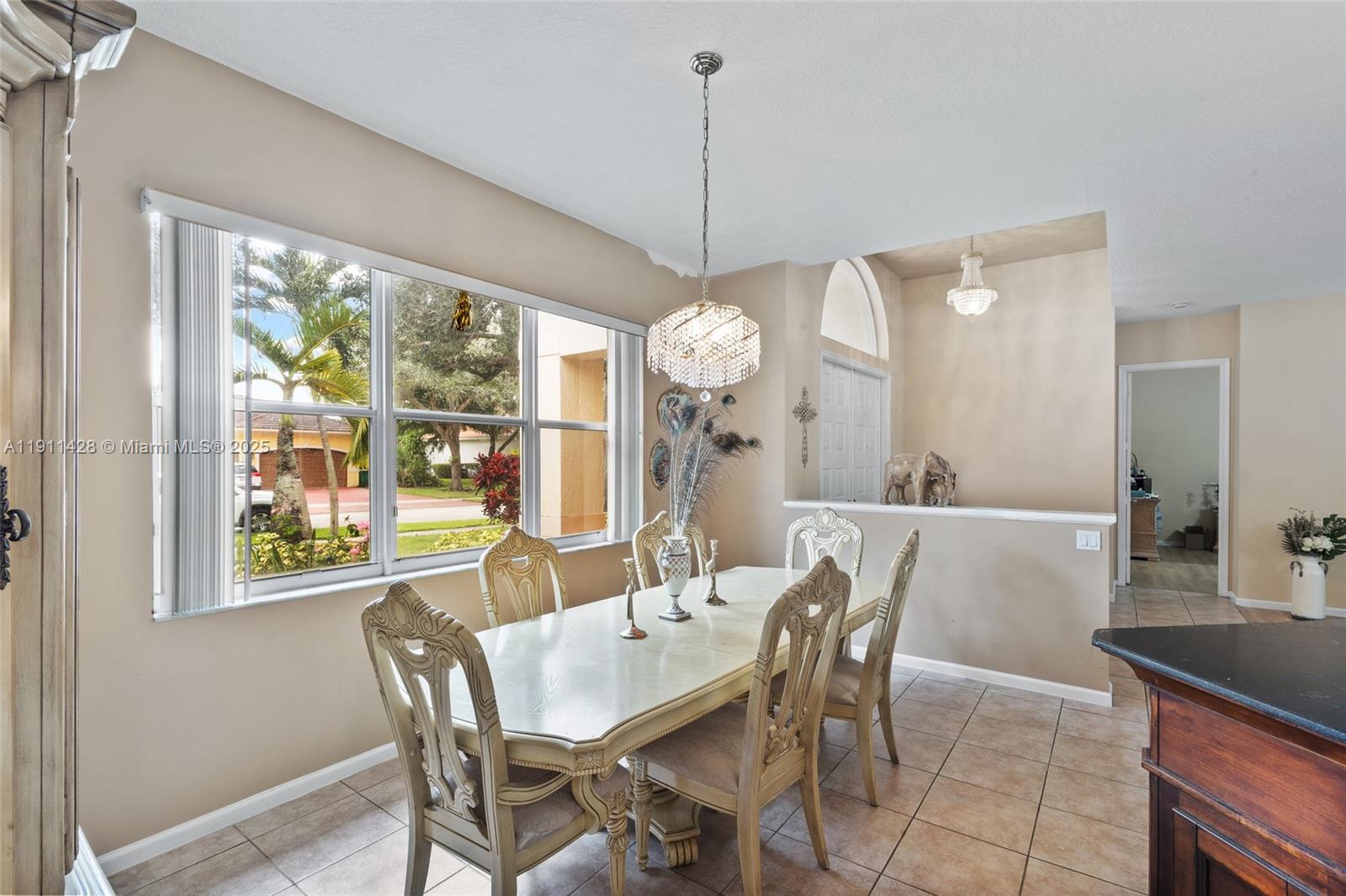 13875 Southwest 41st Street Davie, FL 33330 - Photo 11 of 62 a view of a dining room with furniture window and outside view