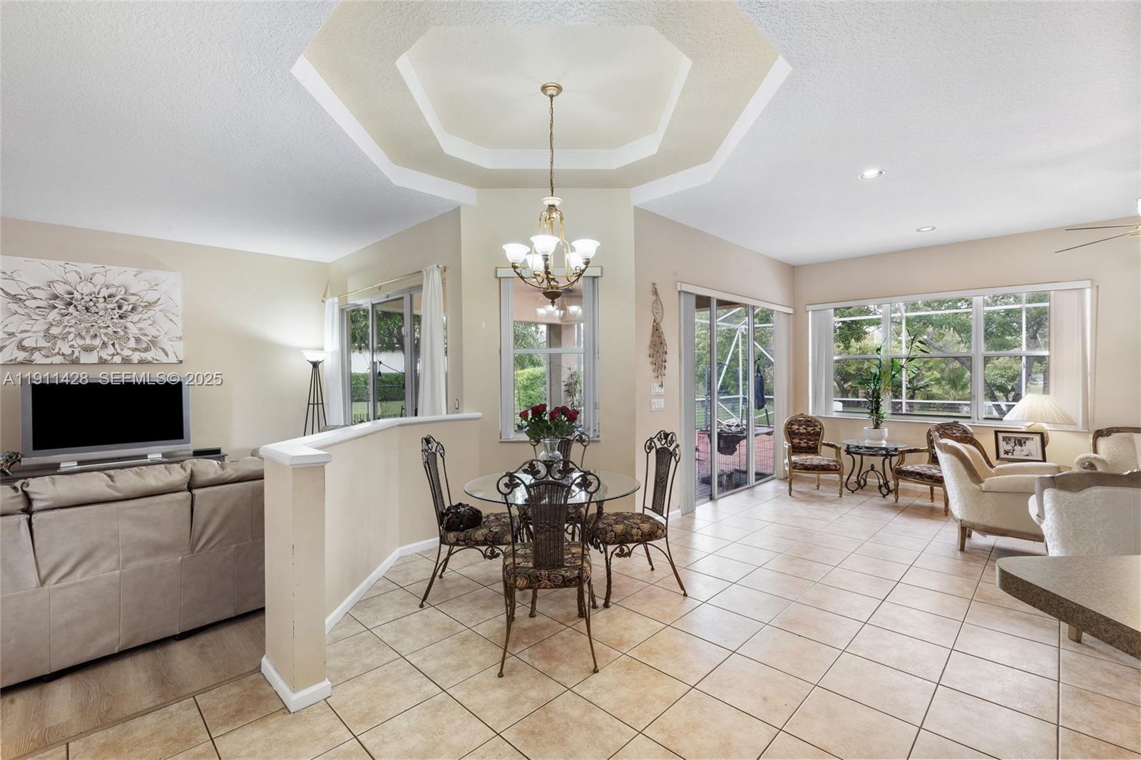 13875 Southwest 41st Street Davie, FL 33330 - Photo 14 of 62 a view of a dining room with furniture window and outside view