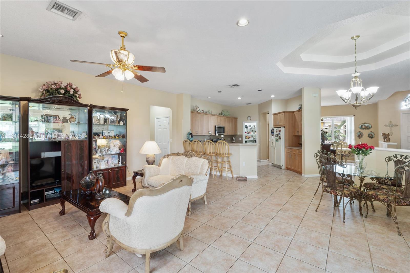 13875 Southwest 41st Street Davie, FL 33330 - Photo 15 of 62 a living room with furniture a dining table and chairs