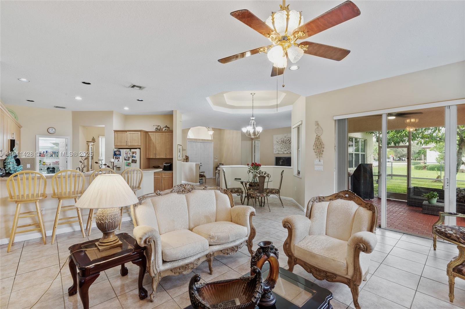 13875 Southwest 41st Street Davie, FL 33330 - Photo 16 of 62 a living room with furniture and a large window