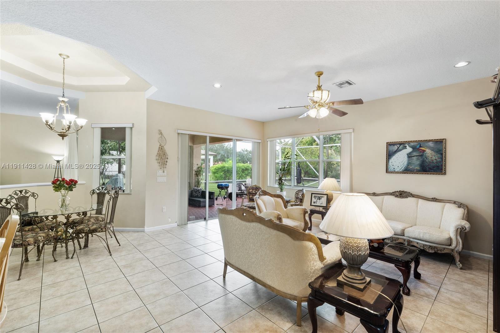 13875 Southwest 41st Street Davie, FL 33330 - Photo 17 of 62 a living room with furniture and a large window