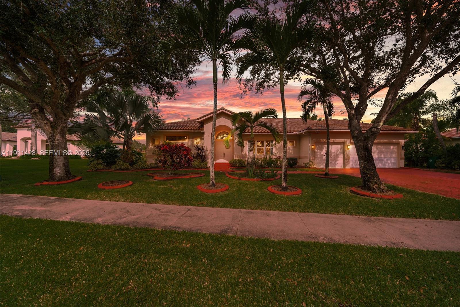 13875 Southwest 41st Street Davie, FL 33330 - Photo 2 of 62 a view of street with large trees