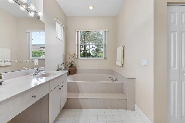 a bathroom with a sink and mirror