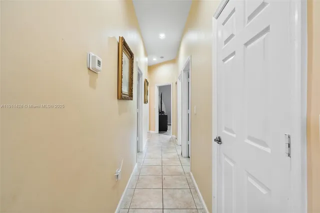 a bedroom with a bed table and a window