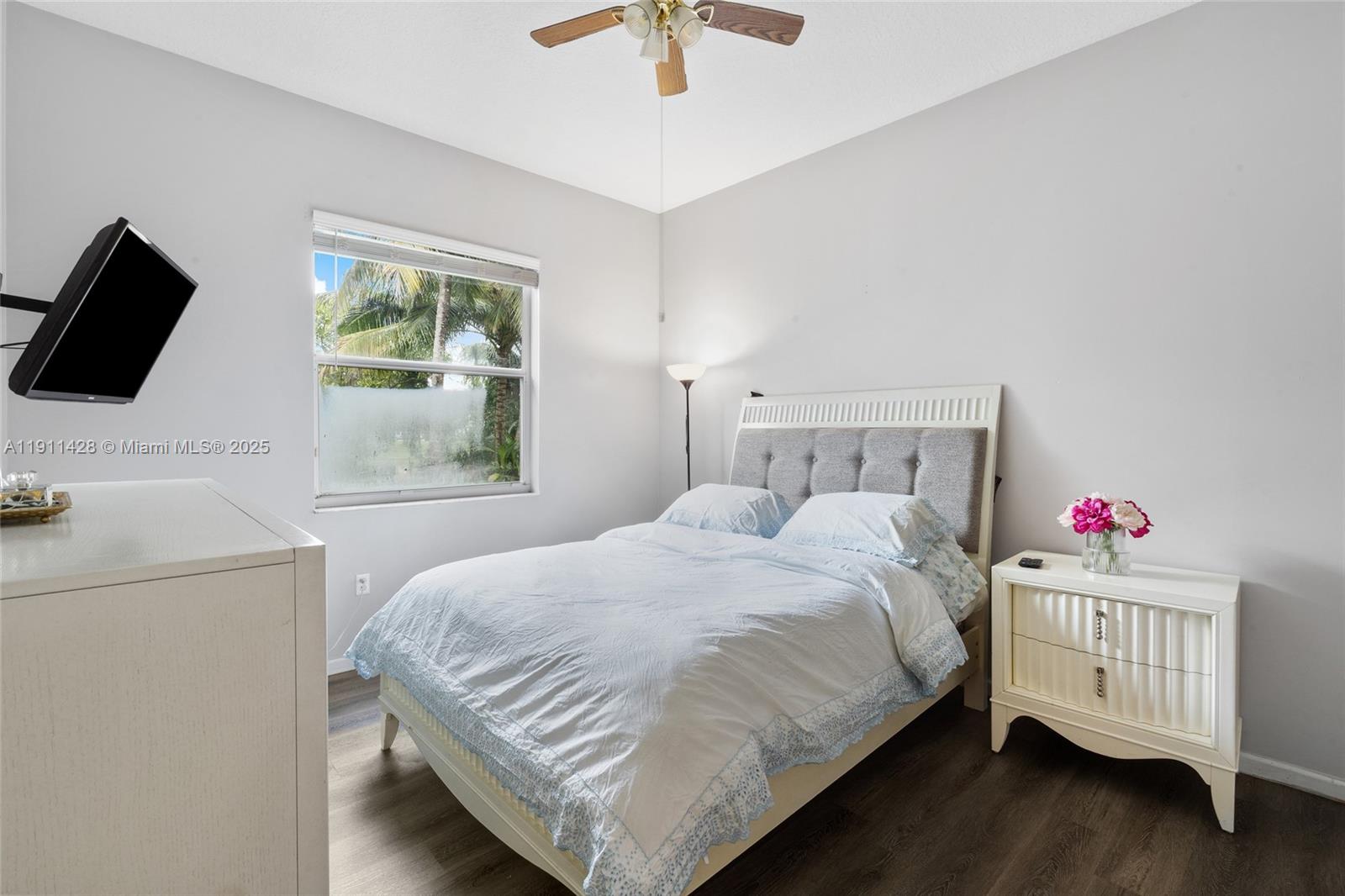 13875 Southwest 41st Street Davie, FL 33330 - Photo 34 of 62 a bedroom with a bed and a window