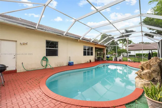 a view of outdoor space with deck and yard