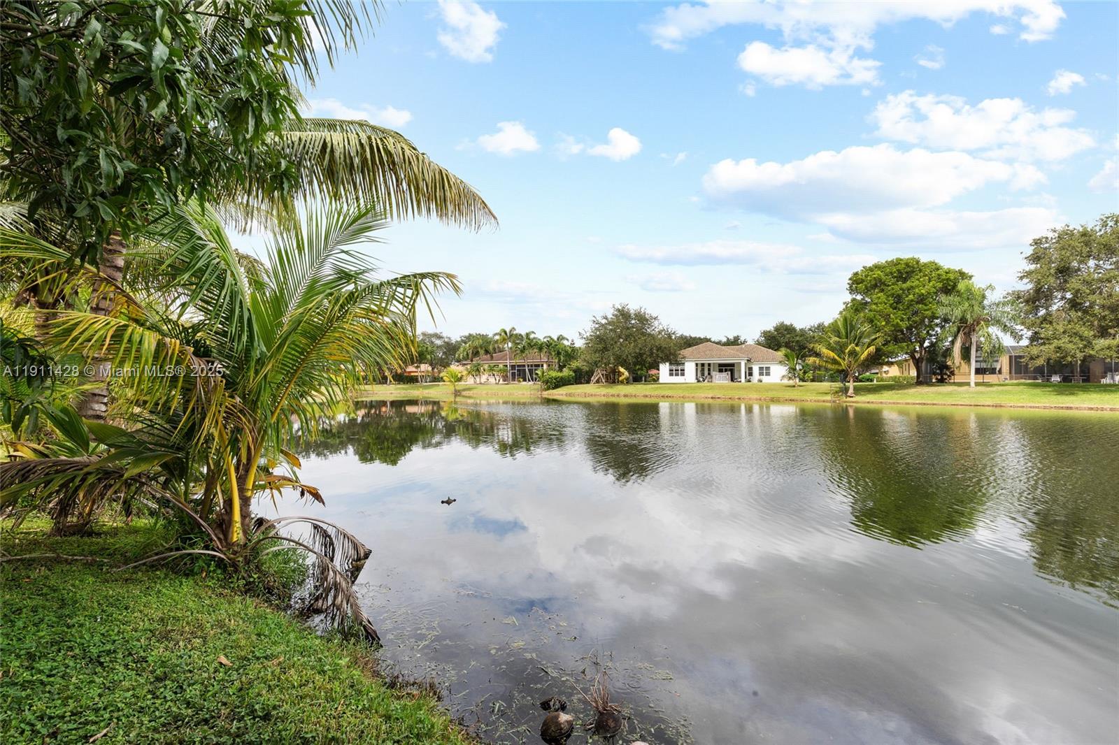 13875 Southwest 41st Street Davie, FL 33330 - Photo 48 of 62 a view of a lake with houses