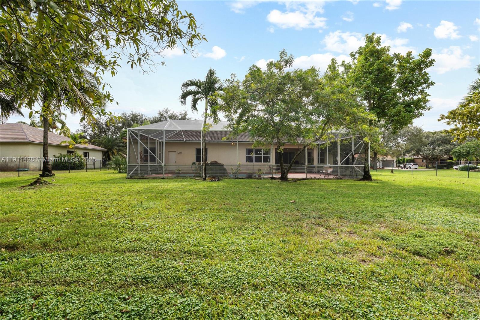 13875 Southwest 41st Street Davie, FL 33330 - Photo 49 of 62 a view of a house with a backyard