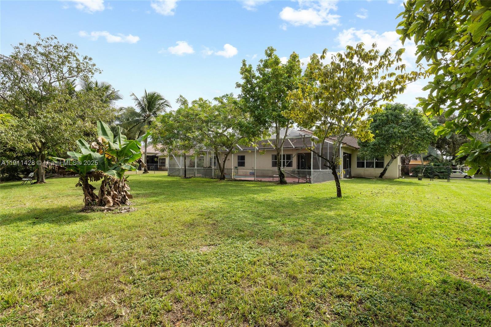 13875 Southwest 41st Street Davie, FL 33330 - Photo 50 of 62 a view of a house with a backyard