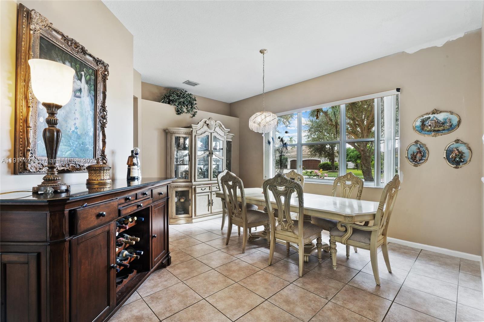 13875 Southwest 41st Street Davie, FL 33330 - Photo 10 of 62 a view of a dining room with furniture window and outside view