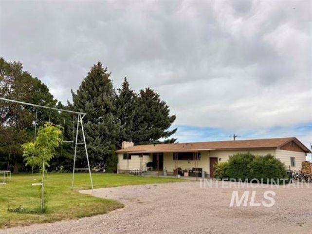 3197 Neeley Road American Falls, ID 83211 - Photo 37 of 45 Ranch-style exterior with a light-colored facade and a brown roof