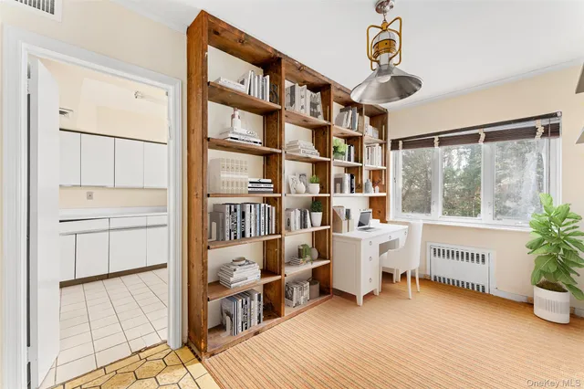 a view of a workspace with furniture and staircase