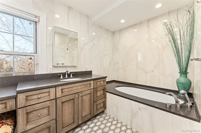 a bathroom with a double vanity sink toilet mirror and shower