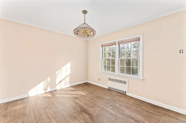 a bedroom with bed and window