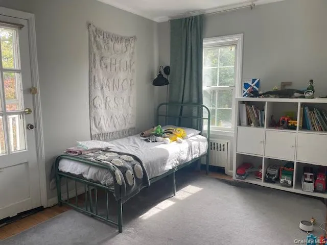 a bathroom with a black and white checkered floor
