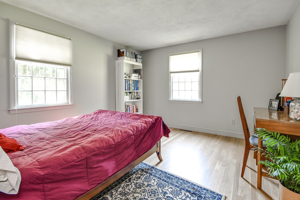 18 Griscom Road Sudbury, MA 01776 - Photo 14 of 29 a bed sitting in a bedroom next to a window