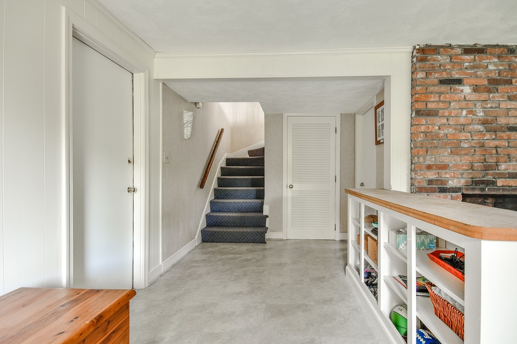 18 Griscom Road Sudbury, MA 01776 - Photo 16 of 29 a view of an entryway with wooden floor and stairs