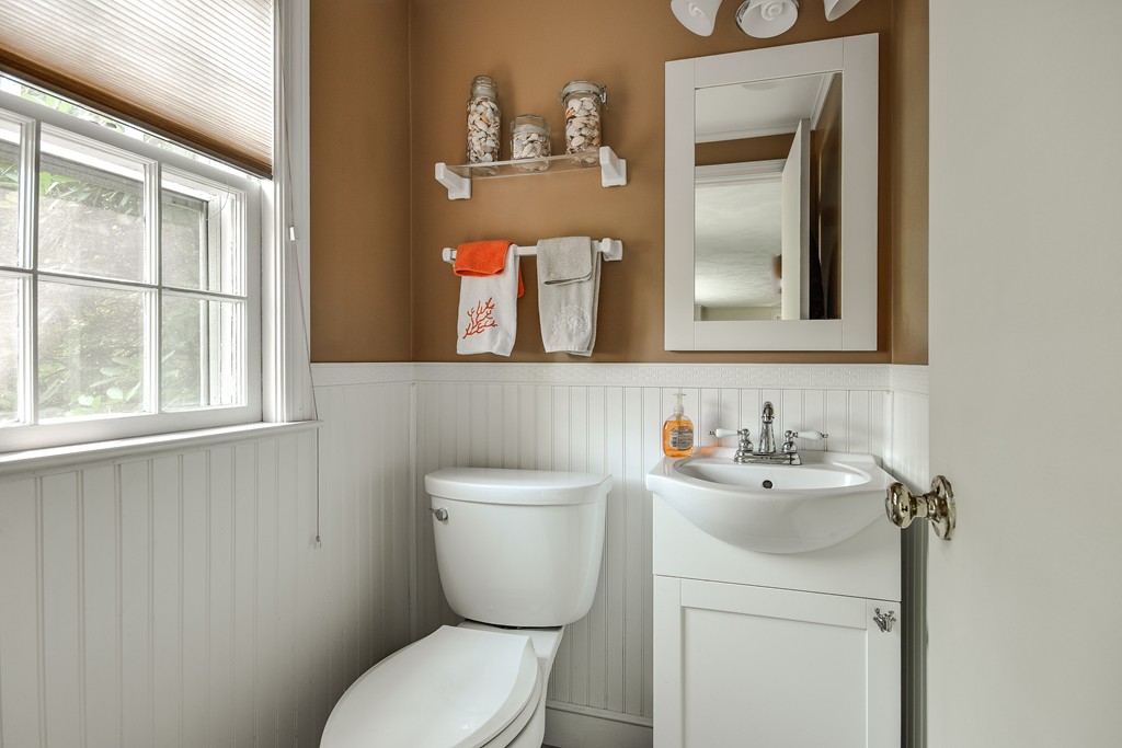 18 Griscom Road Sudbury, MA 01776 - Photo 21 of 29 a bathroom with a toilet sink and mirror