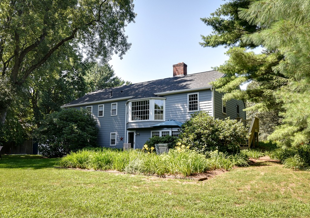 18 Griscom Road Sudbury, MA 01776 - Photo 25 of 29 a front view of house with yard and green space