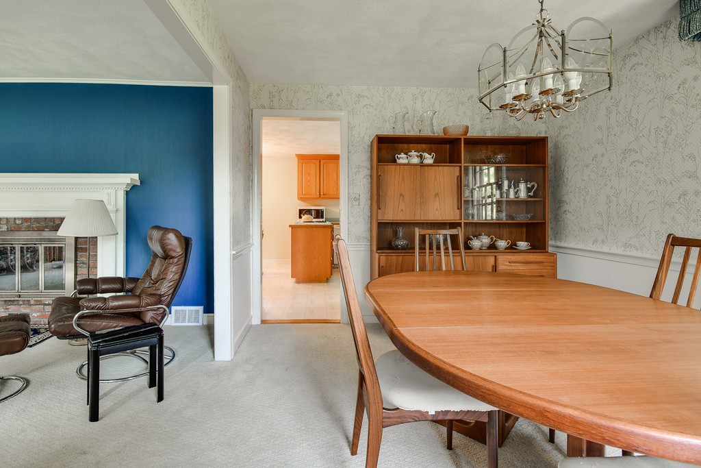 18 Griscom Road Sudbury, MA 01776 - Photo 6 of 29 a dining room with furniture a chandelier and wooden floor