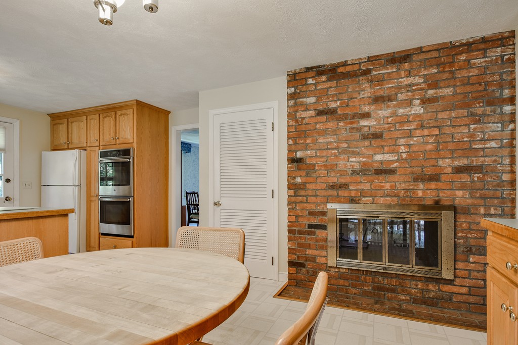 18 Griscom Road Sudbury, MA 01776 - Photo 9 of 29 a bedroom with a bed and a fireplace