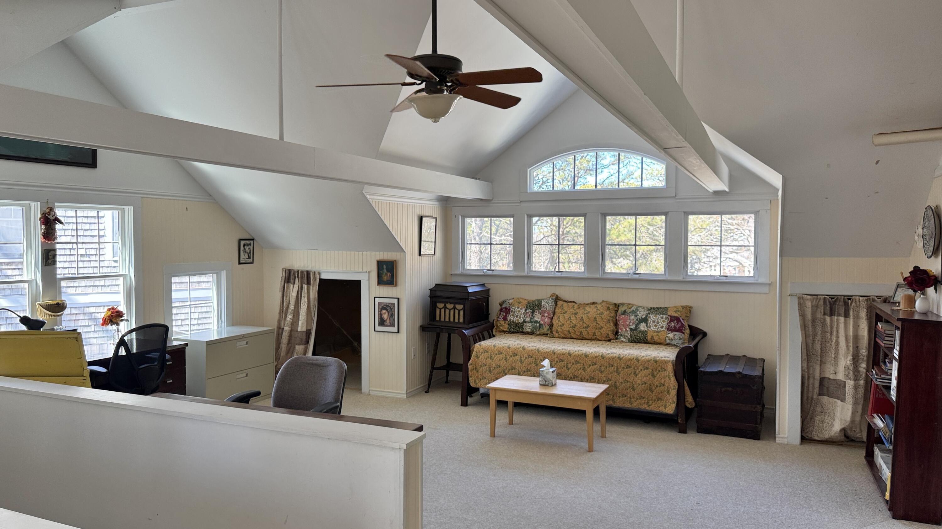 311 South Sunken Meadow Road Eastham, MA 02642 - Photo 46 of 57 a living room with furniture a ceiling fan and a window
