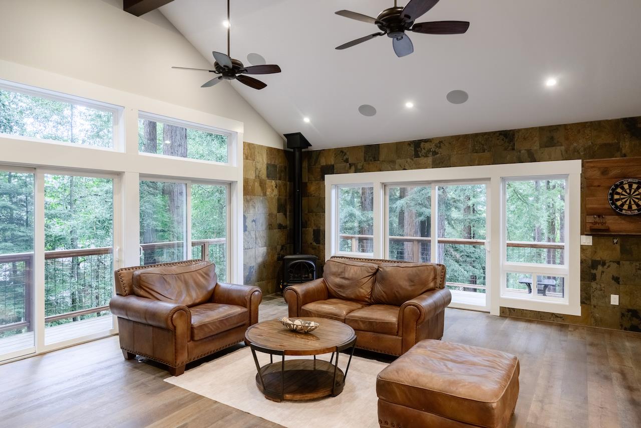 295 Jim's Road Ben Lomond, CA 95005 - Photo 17 of 139 a living room with furniture and a large window with wooden floor