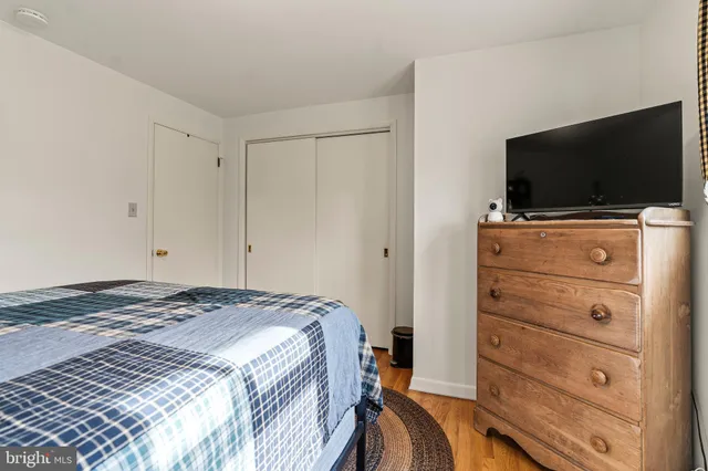 a bathroom with a toilet a sink and a mirror