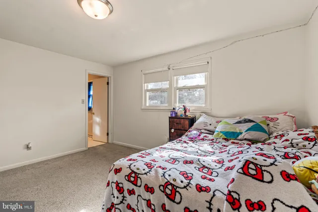 a bathroom with a double vanity sink toilet mirror and bathtub