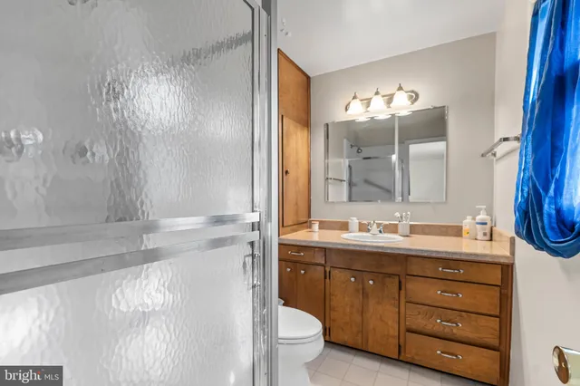 a view of walk in closet with clothes