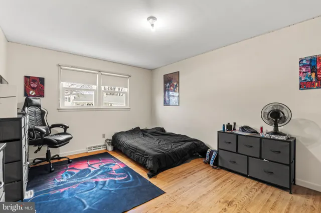 a workspace with furniture and wooden floor