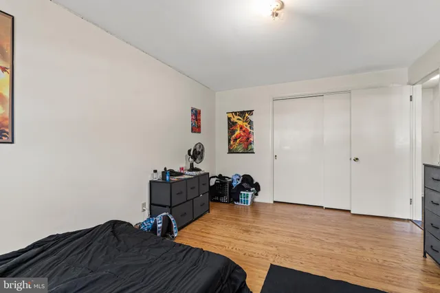 a living room with furniture and a gym equipment