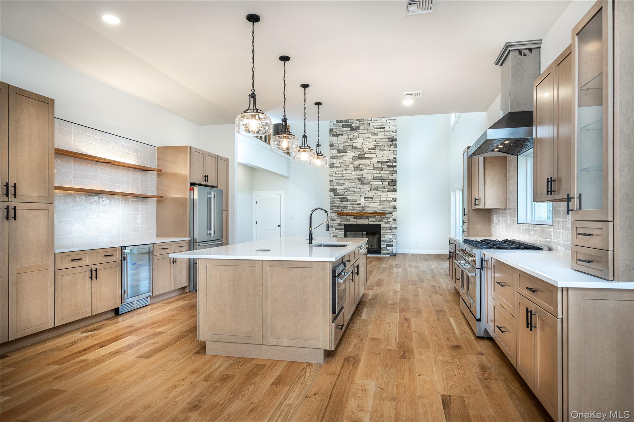 133 West Mombasha Road Monroe, NY 10950 - Photo 12 of 41 a large kitchen with cabinets wooden floor and stainless steel appliances