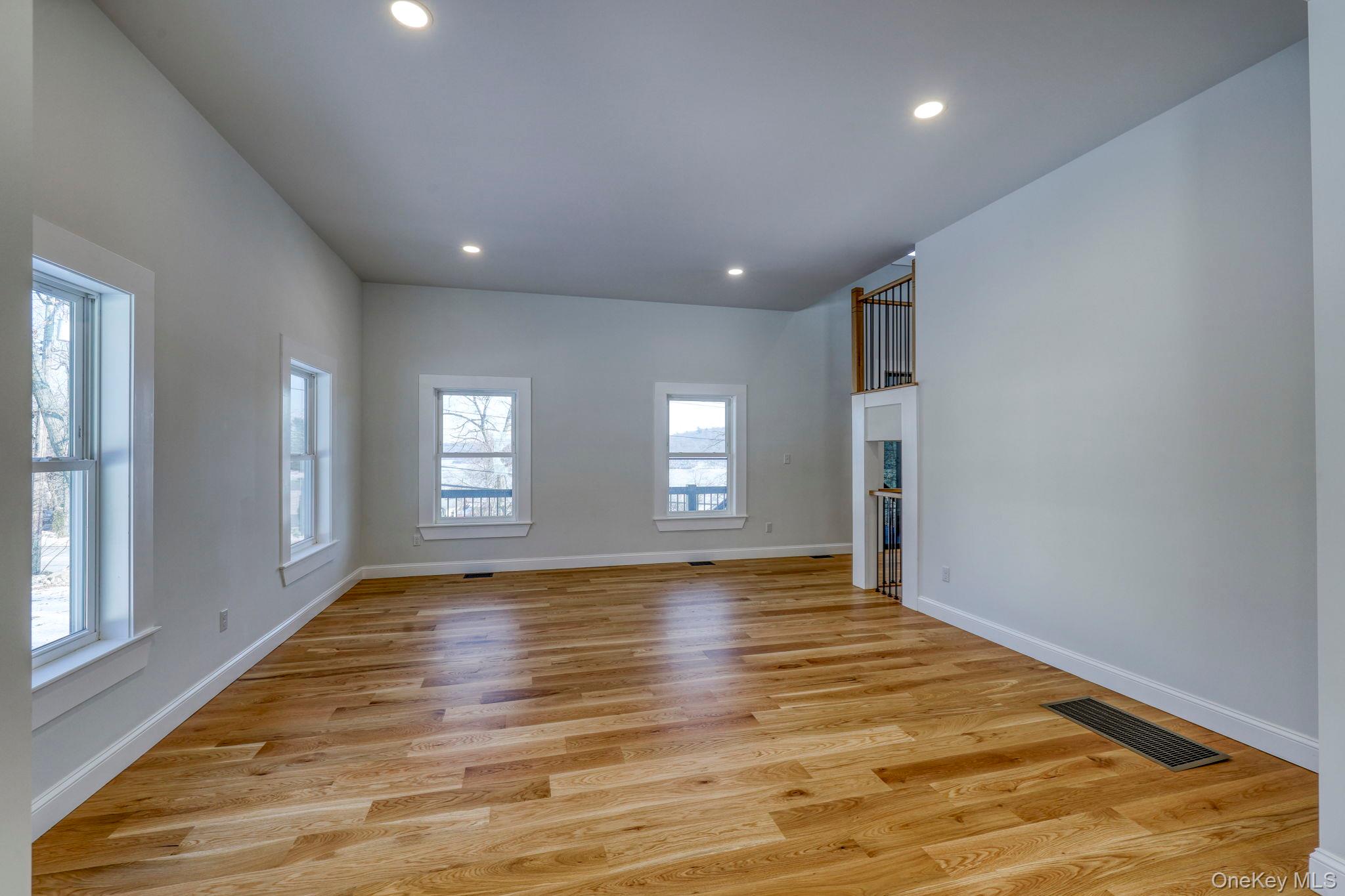 133 West Mombasha Road Monroe, NY 10950 - Photo 12 of 42 an empty room with wooden floor and windows