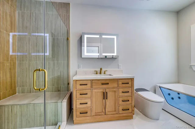a bathroom with a toilet sink and mirror
