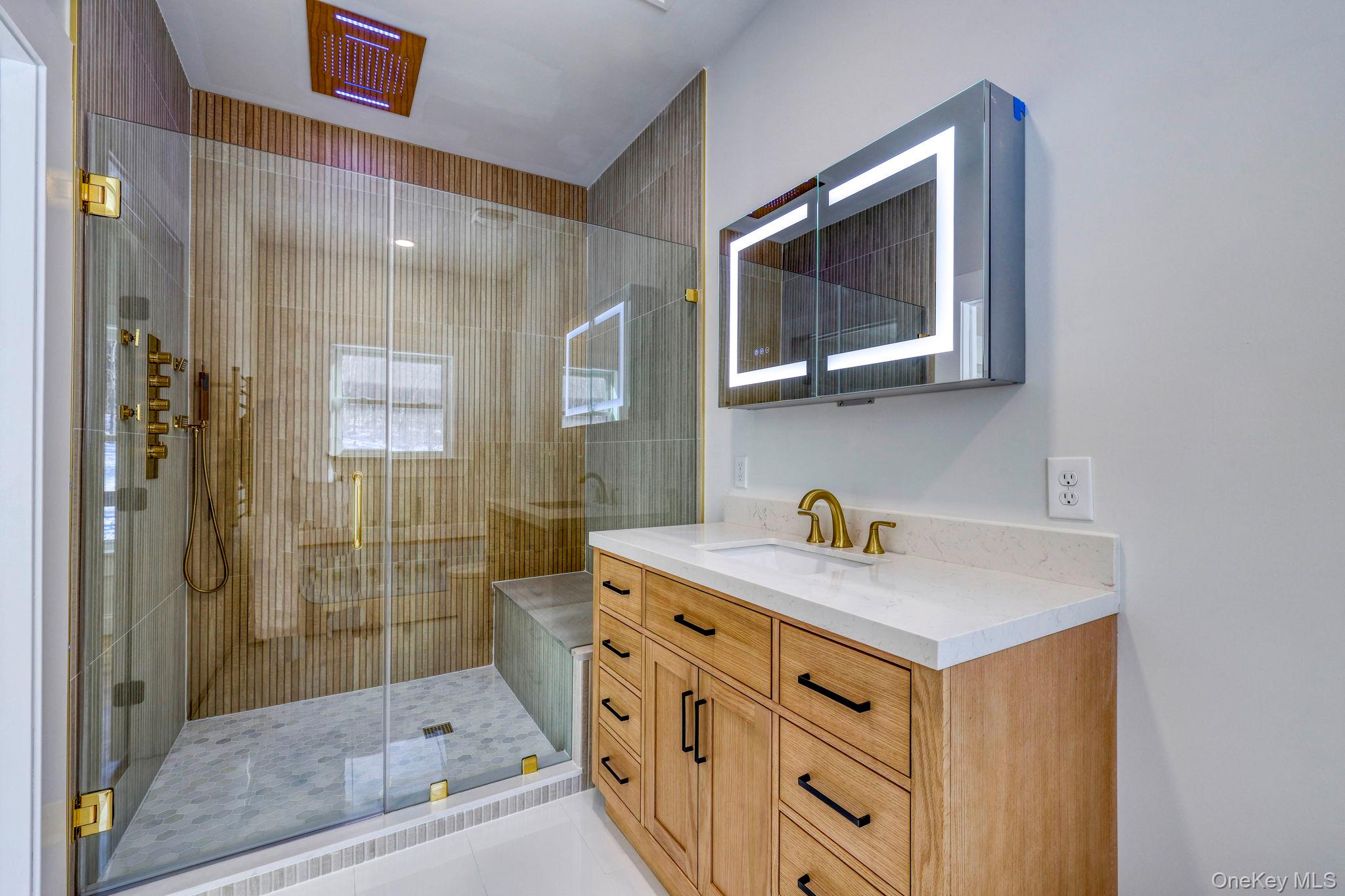 133 West Mombasha Road Monroe, NY 10950 - Photo 16 of 42 a bathroom with a sink a mirror and a shower