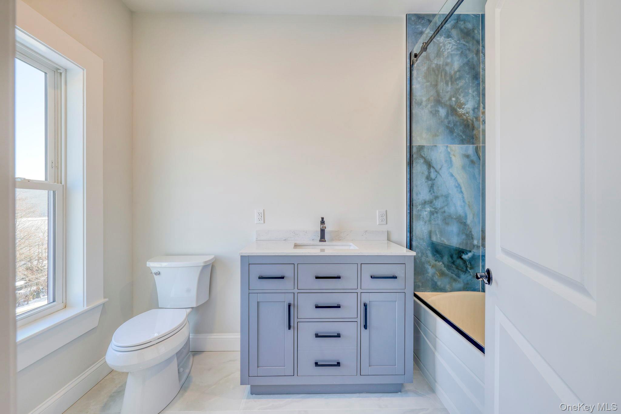 133 West Mombasha Road Monroe, NY 10950 - Photo 21 of 42 a bathroom with a toilet a sink and a window