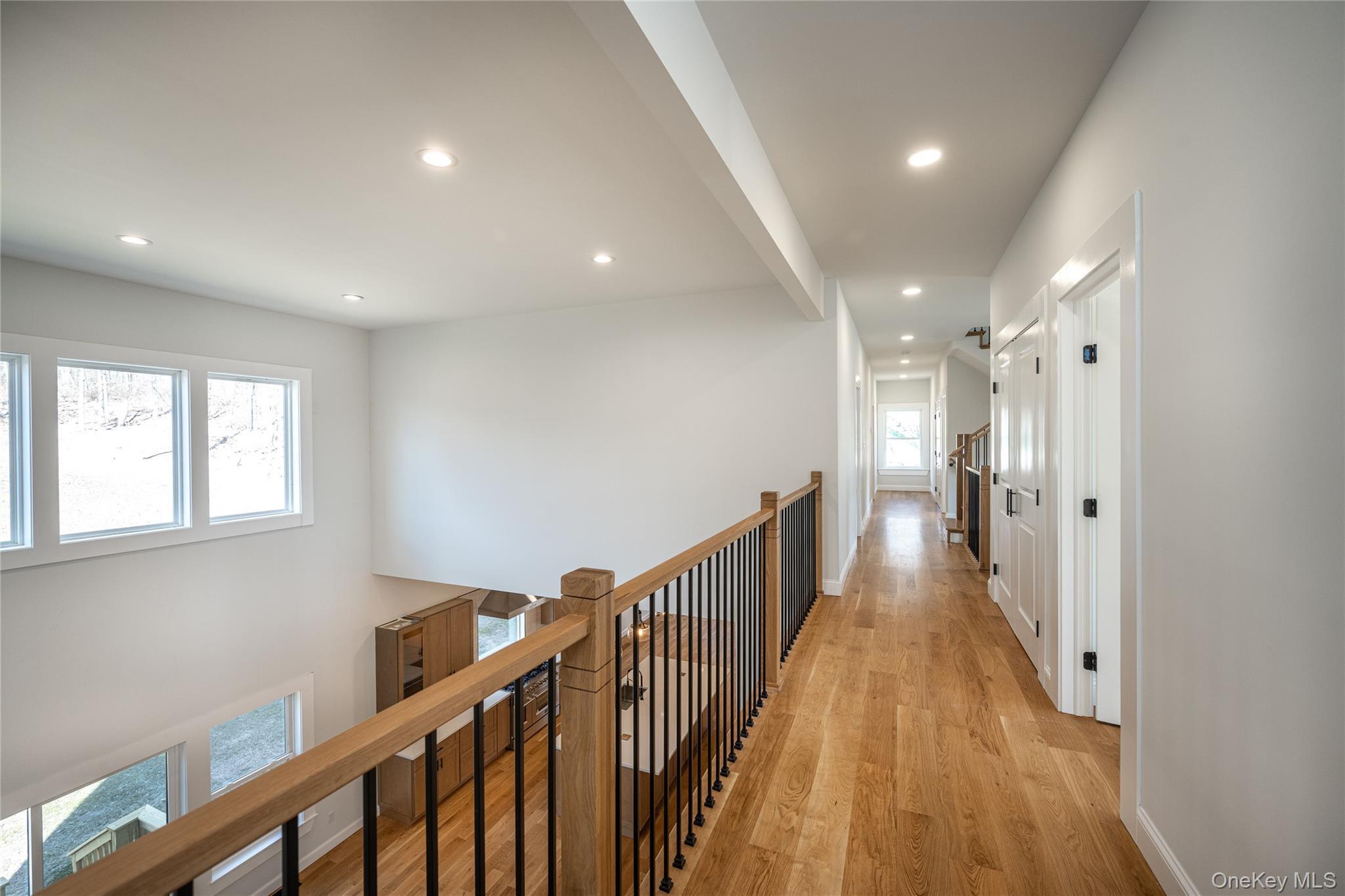 133 West Mombasha Road Monroe, NY 10950 - Photo 22 of 41 a view of a hallway with wooden floor and staircase