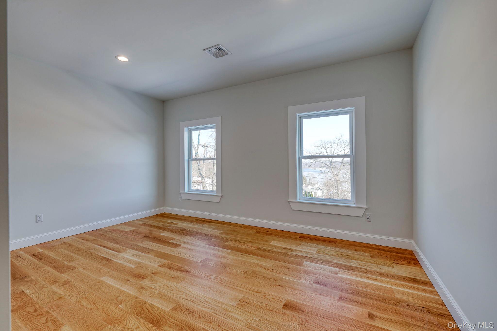 133 West Mombasha Road Monroe, NY 10950 - Photo 24 of 42 a view of empty room with wooden floor and fan