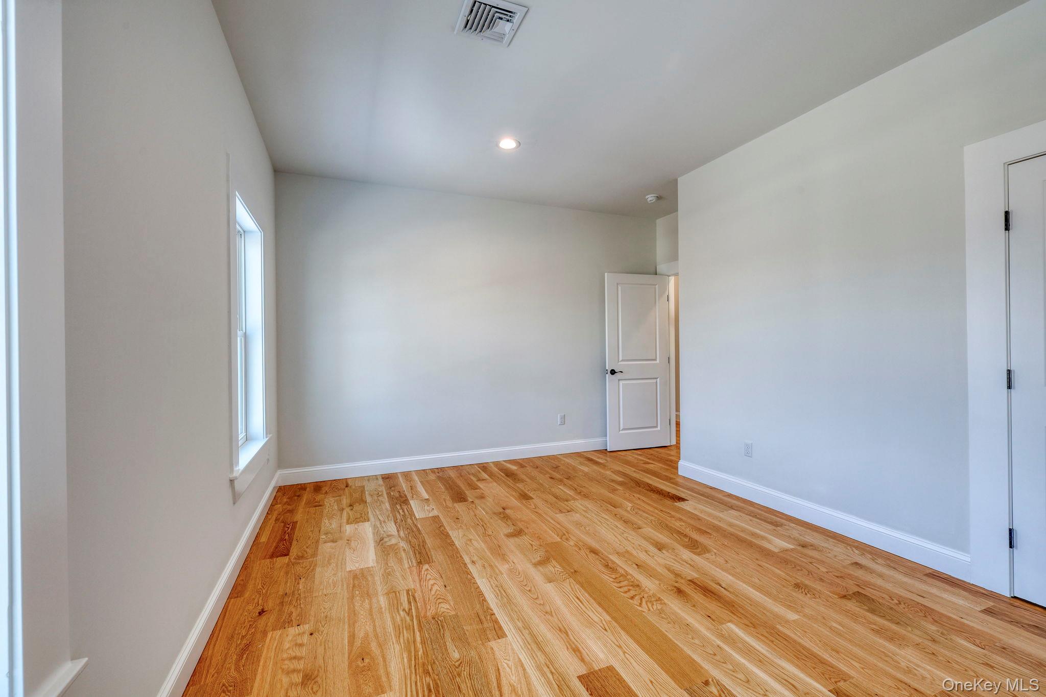 133 West Mombasha Road Monroe, NY 10950 - Photo 25 of 42 a view of empty room with wooden floor