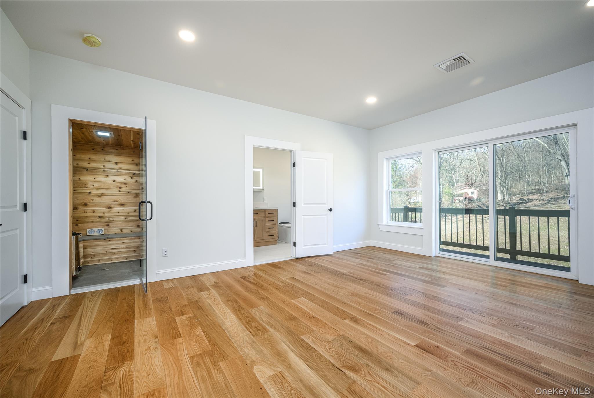 133 West Mombasha Road Monroe, NY 10950 - Photo 26 of 41 a view of an empty room with wooden floor and a window