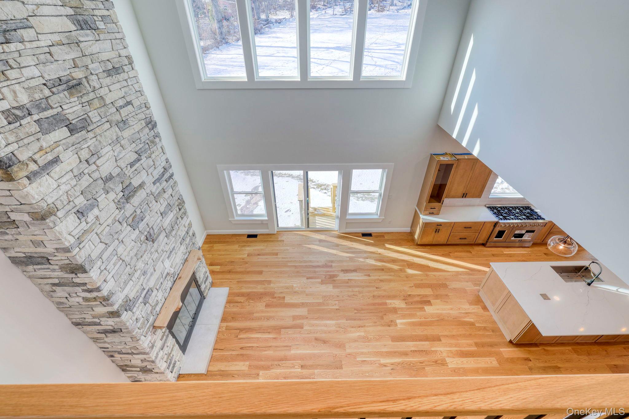 133 West Mombasha Road Monroe, NY 10950 - Photo 30 of 42 a view of an empty room with wooden floor and a window