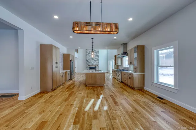 a view of kitchen with cabinets and wooden floor