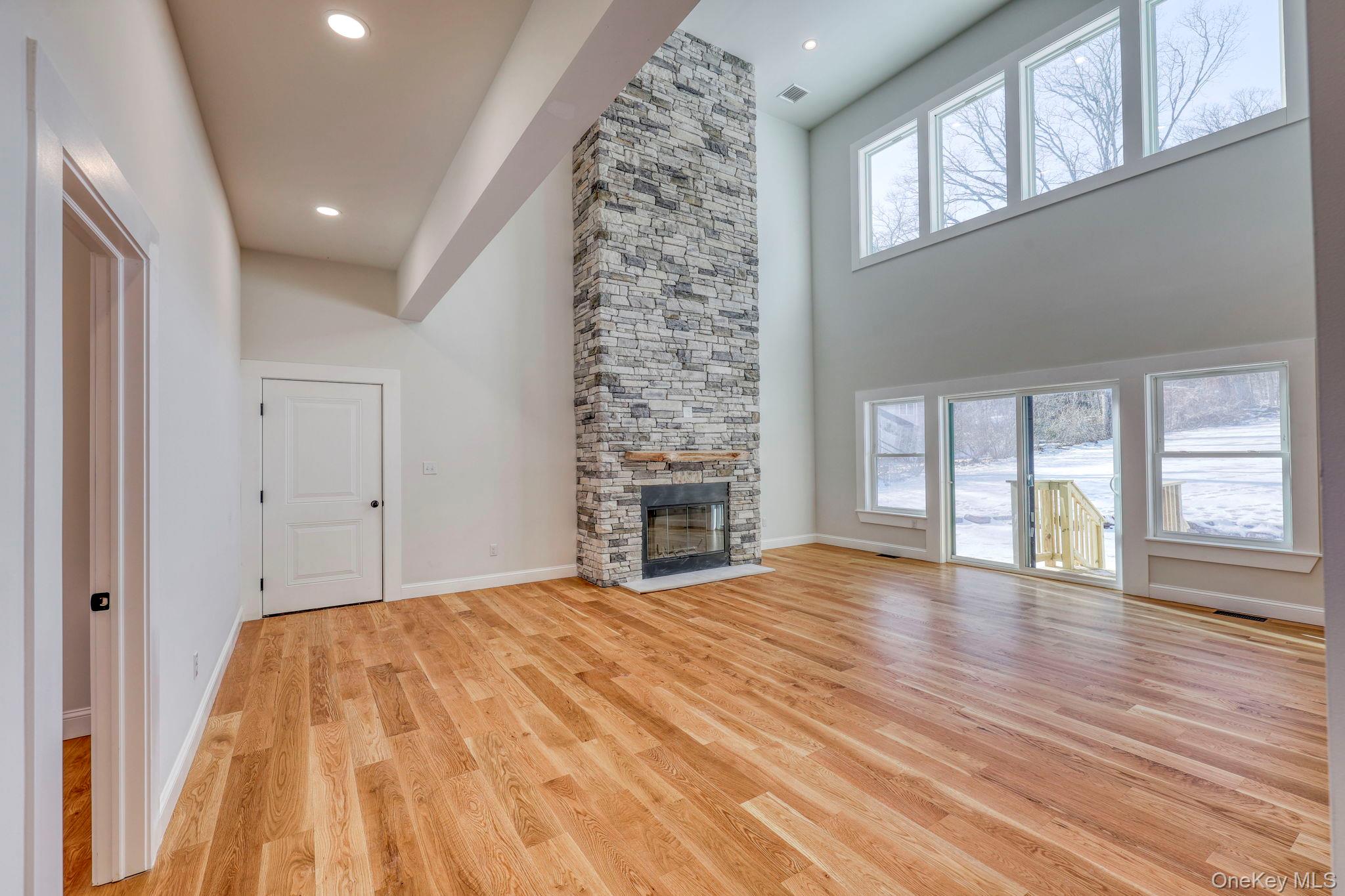 133 West Mombasha Road Monroe, NY 10950 - Photo 9 of 42 a spacious bedroom with a bed and a large window