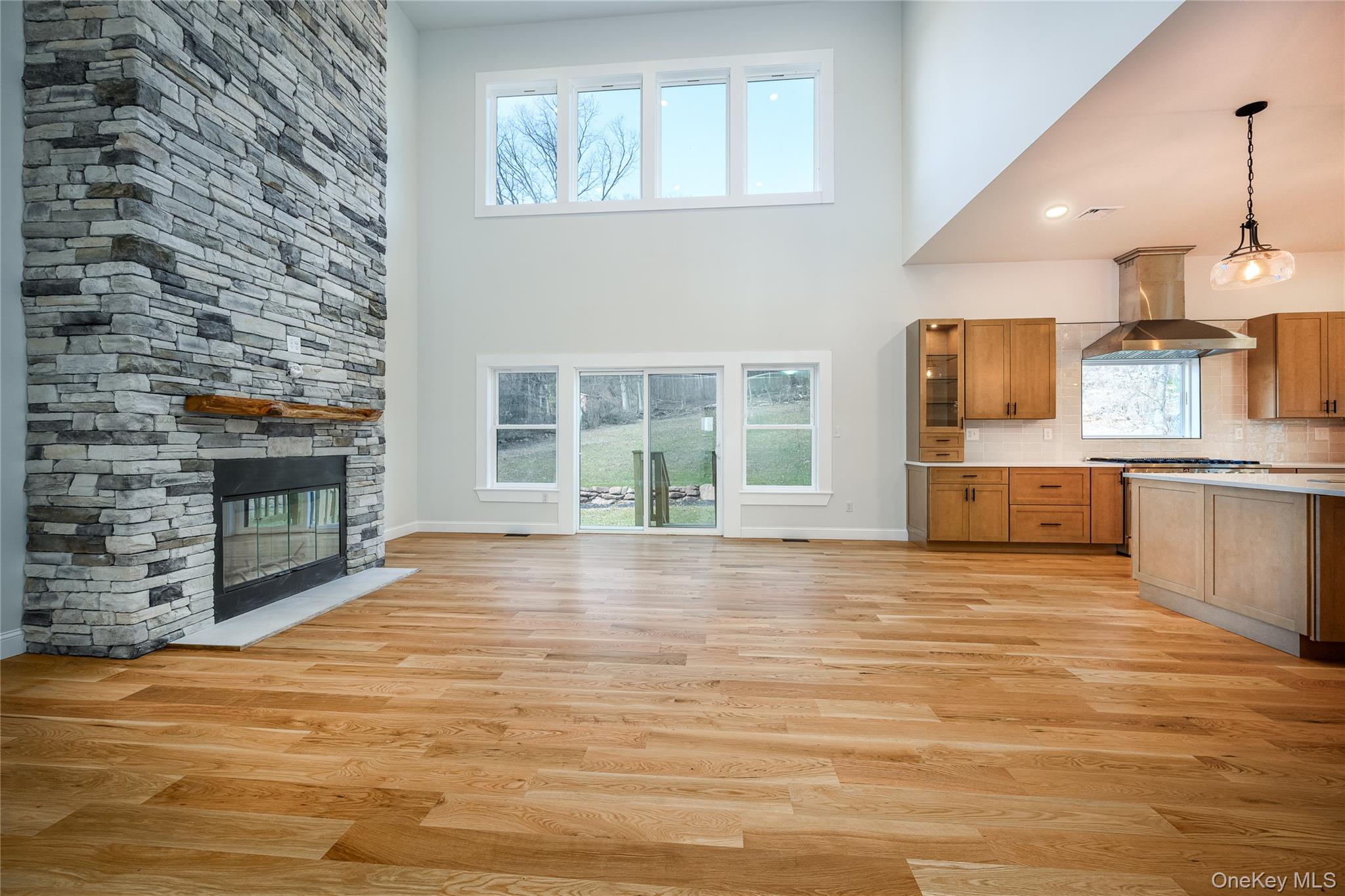 133 West Mombasha Road Monroe, NY 10950 - Photo 9 of 41 a view of a kitchen with furniture and a fireplace