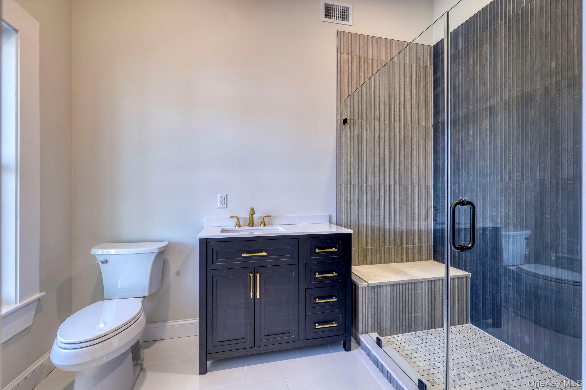 133 West Mombasha Road Monroe, NY 10950 - Photo 10 of 42 a bathroom with a sink a toilet and shower