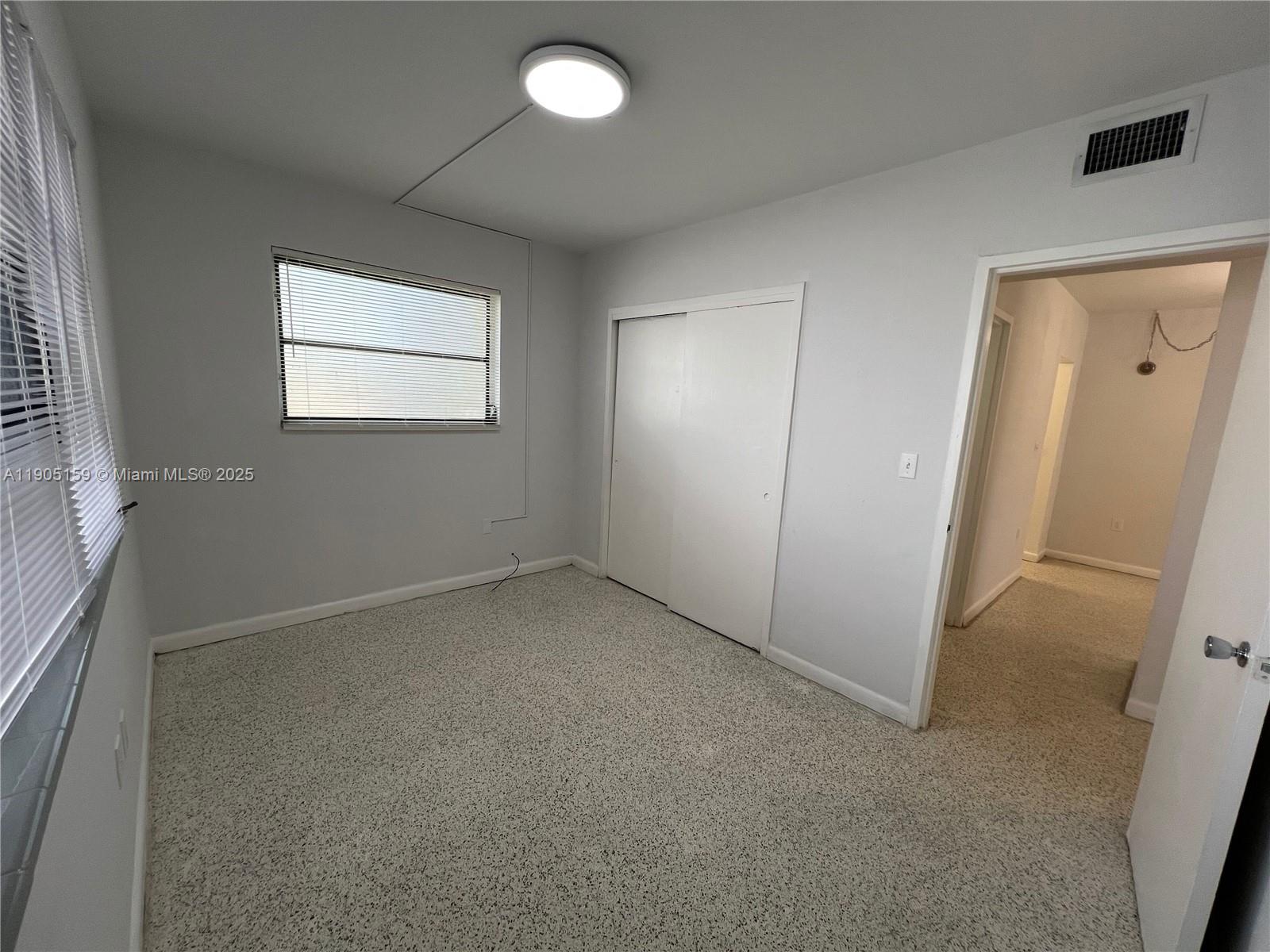 675 Southwest 7th Avenue, Unit 7 Miami, FL 33130 - Photo 11 of 16 an empty room with windows