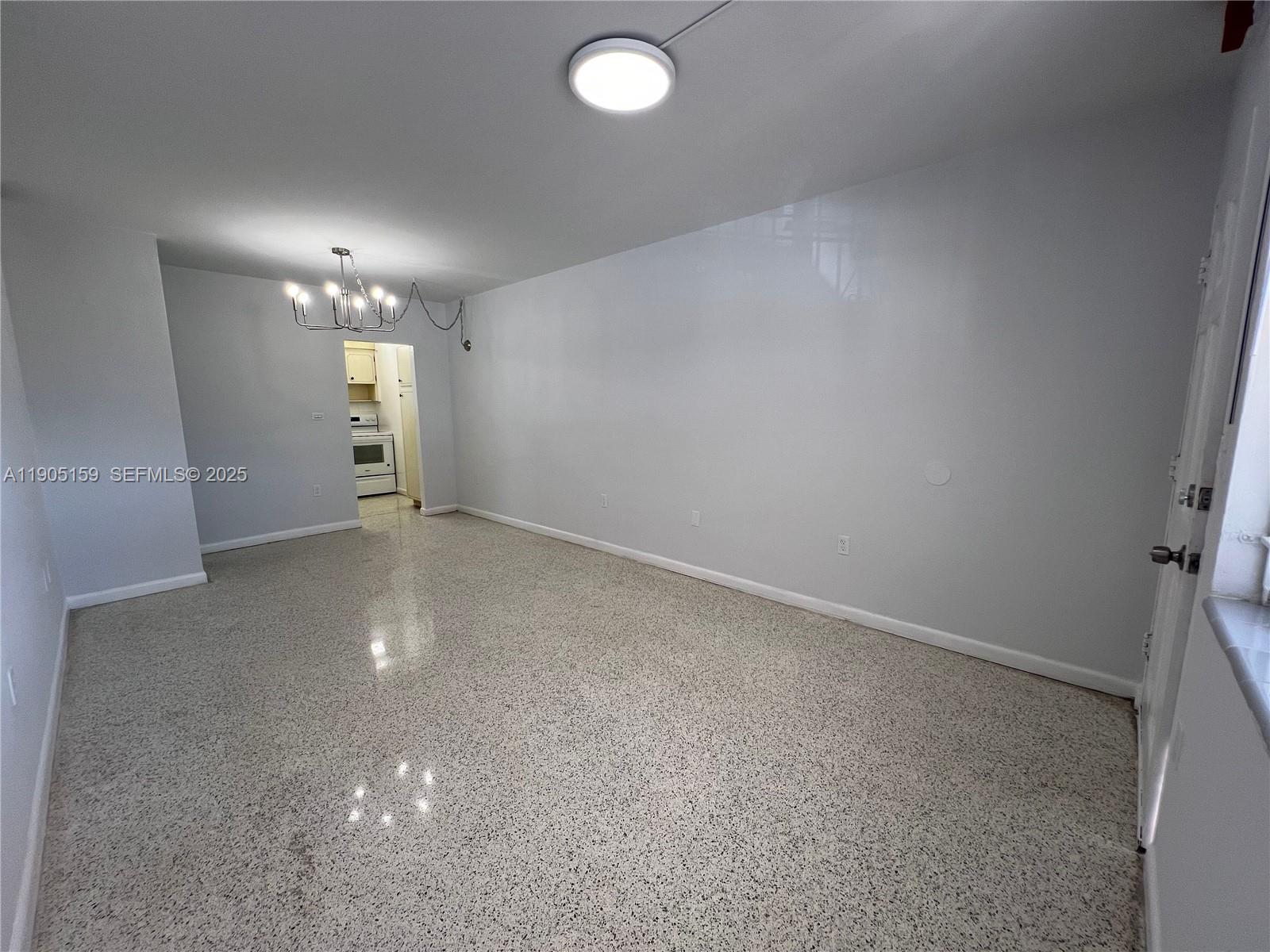 675 Southwest 7th Avenue, Unit 7 Miami, FL 33130 - Photo 4 of 16 an empty room with windows and closet