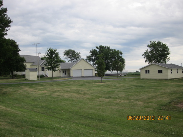 a view of a big yard with a house